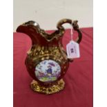 A 19th Century copper lustre jug decorated with chinoiserie panels. 8" high.