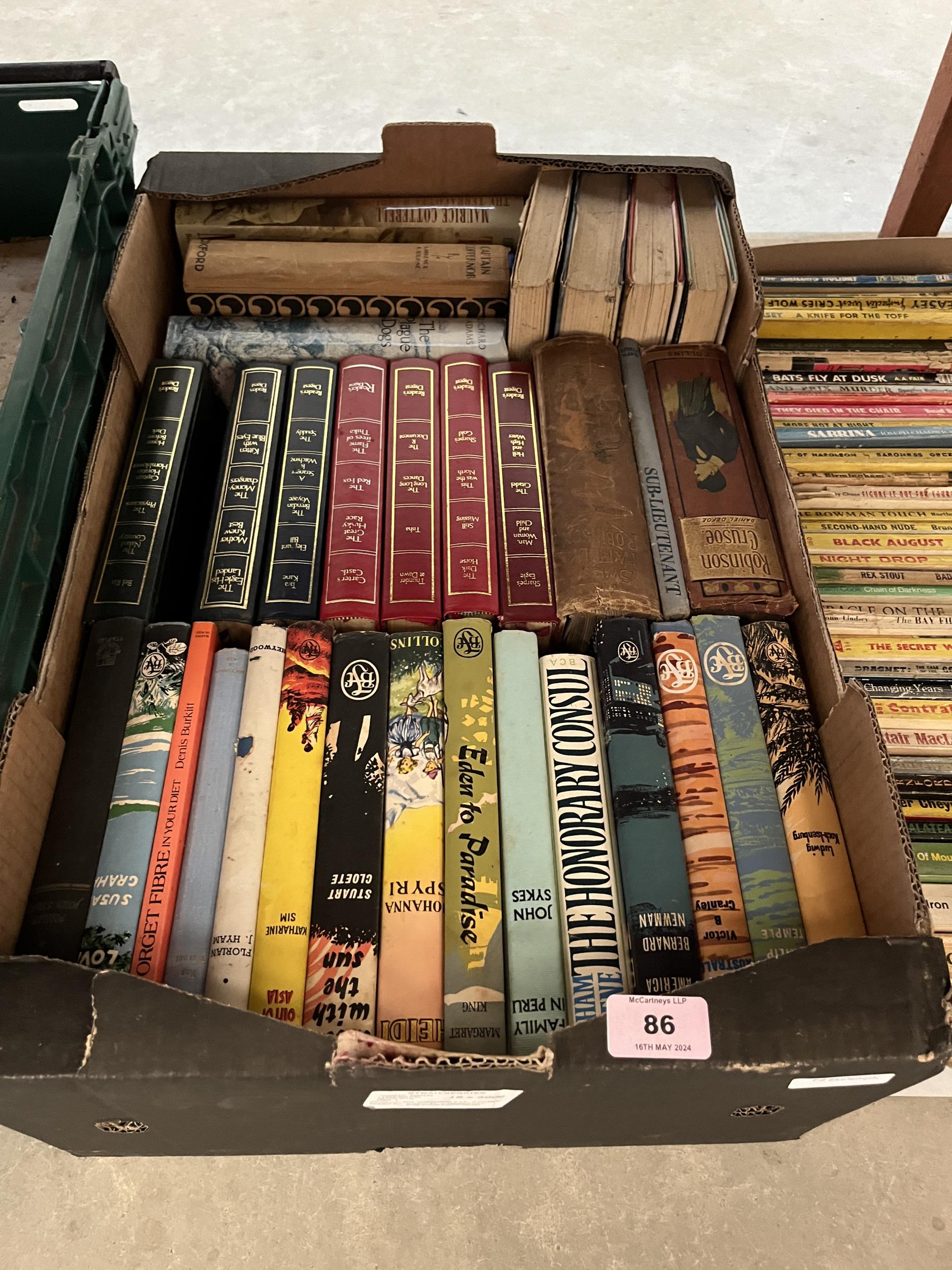 A box of hardback books including seven Reader's Digest condensed books.