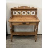 A Victorian pine washstand with tiled splashback. 36" wide.