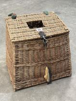 A wicker fishing basket, 14" wide.