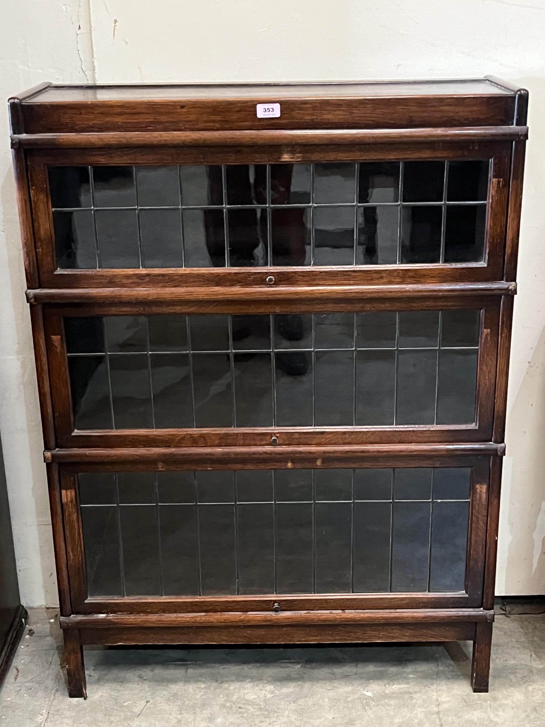 An oak Globe Wernicke bookcase in three leaded glazed sections. 34" w x 47" h.