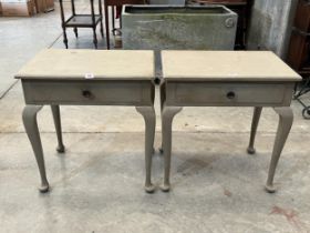 A pair of painted side tables on cabriole legs. 26" wide.