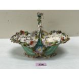 A 19th Century Coalport porcelain basket, encrusted with a profusion of coloured flowers on a