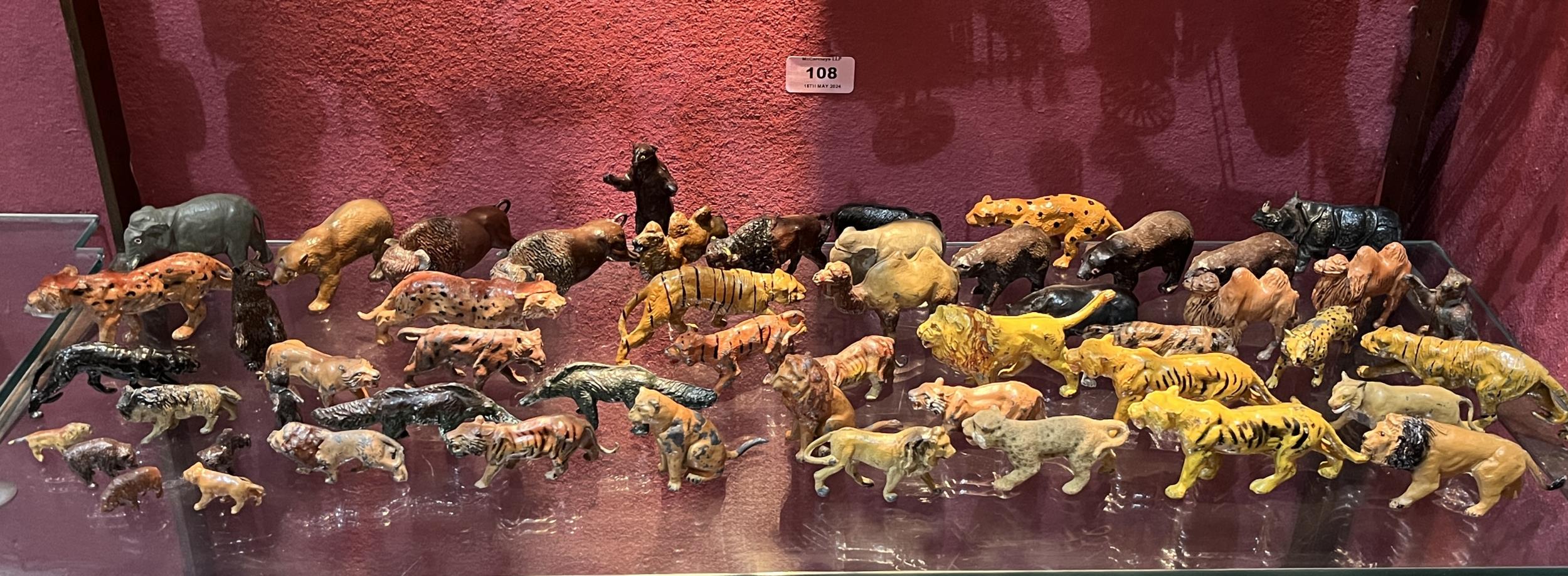 A collection of cold painted metal toy wild animals.