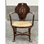 An Edward VII mahogany and inlaid open armchair in the manner of Cornelius Smith, with shaped curved