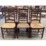 A set of four and a pair of ladder back chairs with rush seats.