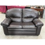 A leather sofa, 60" wide.