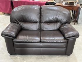 A leather sofa, 60" wide.