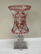 A ruby overlaid cut glass flower vase. 13¾" high.