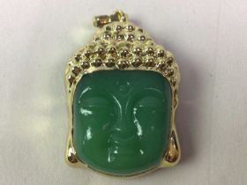 JADE PENDANT, IN THE FORM OF A BUDDHA HEAD