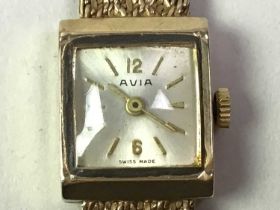 NINE CARAT GOLD WATCH, ALONG WITH A BANGLE AND A RING