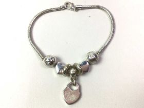 COLLECTION OF CHARM BRACELETS AND NECKLACES,