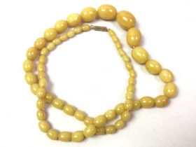 GROUP OF AMBER BEADS,