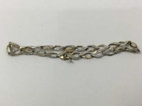 NINE CARAT GOLD BRACELET,