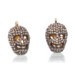 PAIR OF DIAMOND SKULL PENDANTS,