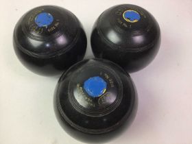 GROUP OF FOUR LAWN BOWLS,