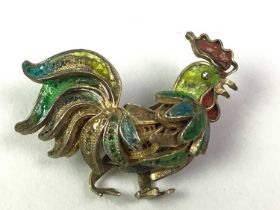 SILVER-GILT AND ENAMEL COCKEREL BROOCH AND OTHERS,