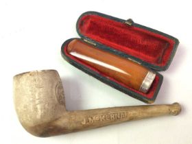 ANTIQUE SILVER AND AMBER CHEROOT HOLDER, AND A CLAY PIPE