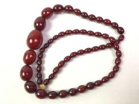 TWO CHERRY BAKELITE NECKLACES,