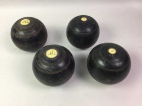 TWO SETS OF LAWN BOWLS,