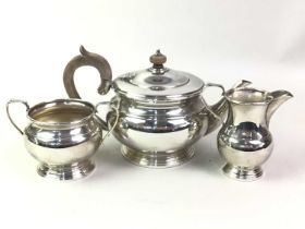 SILVER PLATED TEA SERVICE, ALONG WITH A CAKE BASKET AND CANDLESTICKS