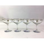 COLLECTION OF GLASS CHAMPAGNE COUPES, BRANDED FOR BABYCHAM