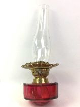 VICTORIAN BRASS AND CRANBERRY GLASS OIL LAMP, ALONG WITH TWO FURTHER LAMPS