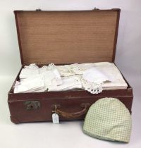 GROUP OF VINTAGE SUITCASES, AND SOME VINTAGE LINEN