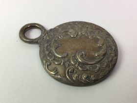 SILVER BACKED MIRROR, AND TWO SILVER HANDLED MAGNIFYING GLASSES