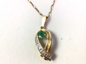 NINE CARAT GOLD EMERALD AND DIAMOND PENDANT,