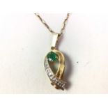 NINE CARAT GOLD EMERALD AND DIAMOND PENDANT,