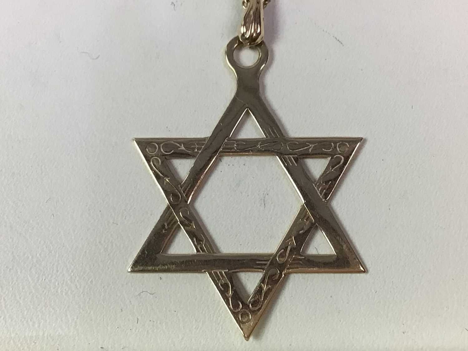 NINE CARAT GOLD STAR OF DAVID PENDANT,