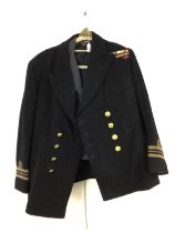 BRITISH NAVAL LIEUTENANT COMMANDER JACKET AND CAP, ALONG WITH FURTHER UNIFORM