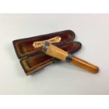 SILVER AND AMBER CIGARETTE HOLDER,