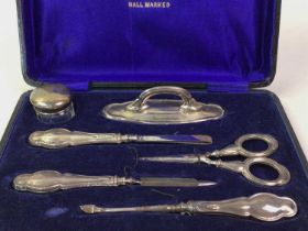 TWO SILVER MANICURE SETS,