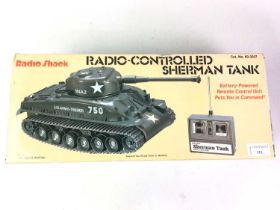 RADIO SHACK REMOTE CONTROL TANK, AND AN ACTION MAN TRAINING TOWER