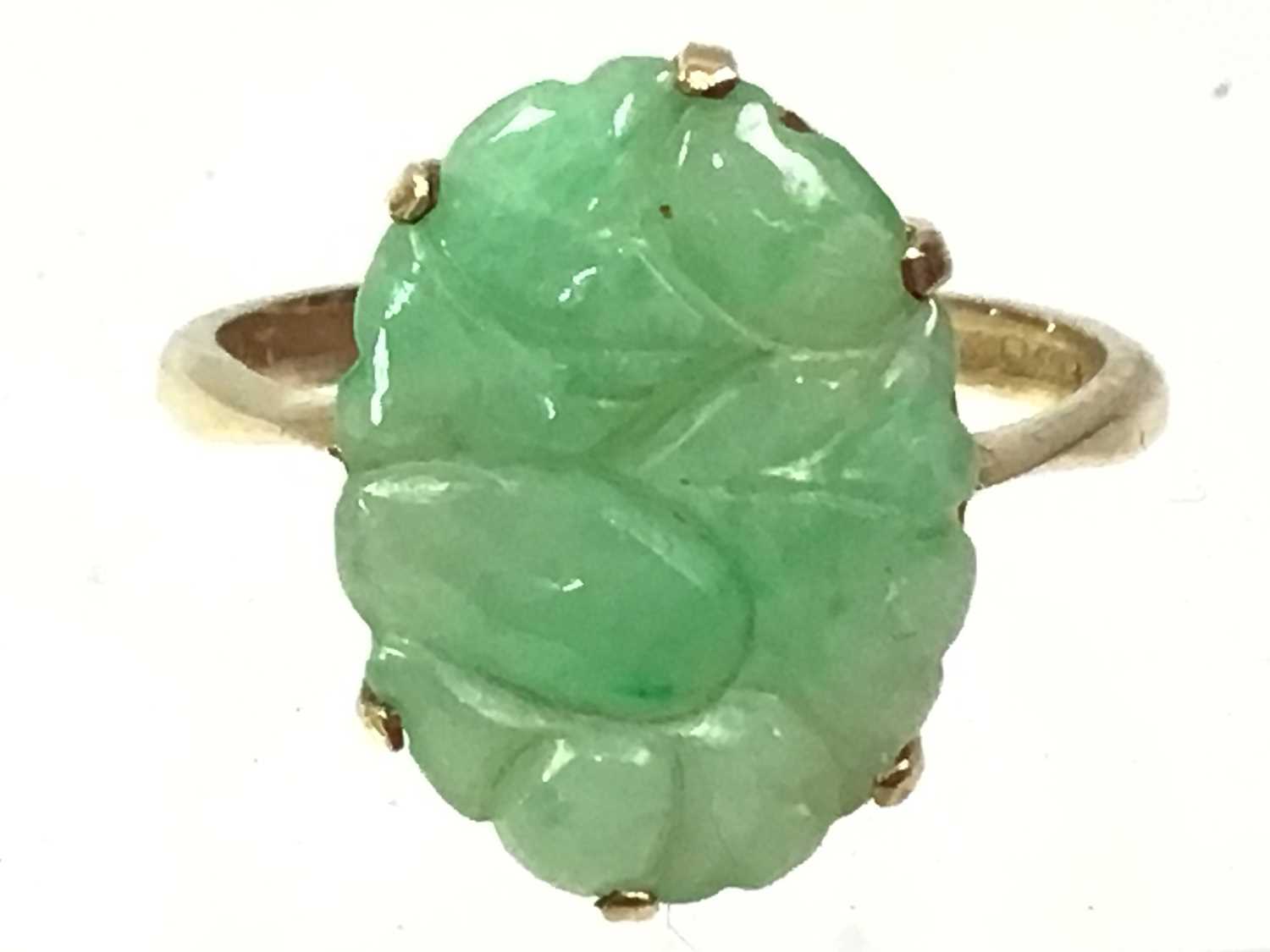 FOUR GREEN HARDSTONE RINGS,