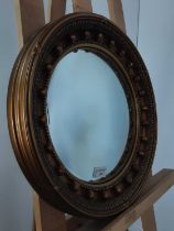 TWO GILT CONVEX WALL MIRRORS,