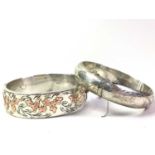 TWO SILVER BANGLES,