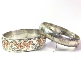 TWO SILVER BANGLES,