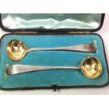 PAIR OF GEORGE III SILVER AND PARCEL GILT MUSTARD SPOONS, LONDON 1802