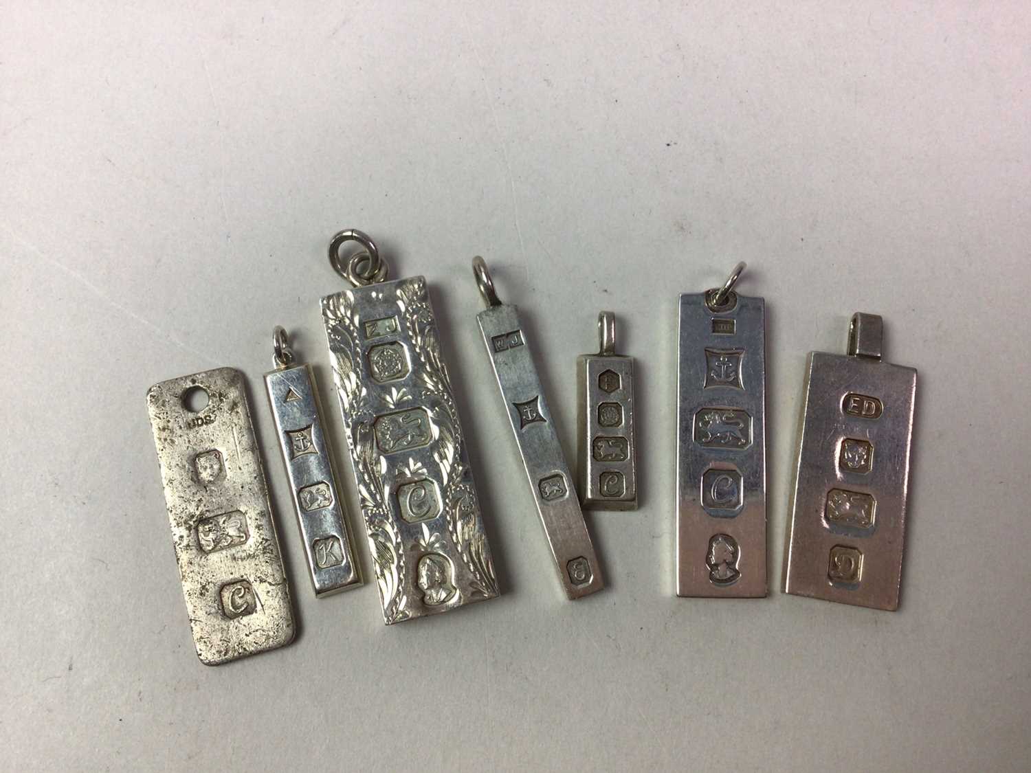 COLLECTION OF SILVER INGOT PENDANTS, - Image 2 of 2