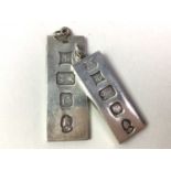 COLLECTION OF SILVER INGOT PENDANTS,