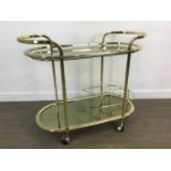 ATTRIBUTED TO MILO BAUGHMAN, GILT METAL AND GLASS DRINKS TROLLEY, CIRCA 1970-79