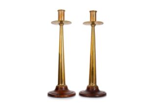 PAIR OF ARTS & CRAFTS BRASS CANDLESTICKS, CIRCA 1880-1900