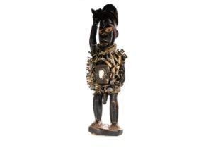 WEST-AFRICAN TRIBAL NAIL-STUDDED CARVED FIGURE, CIRCA EARLY-MID 20TH CENTURY