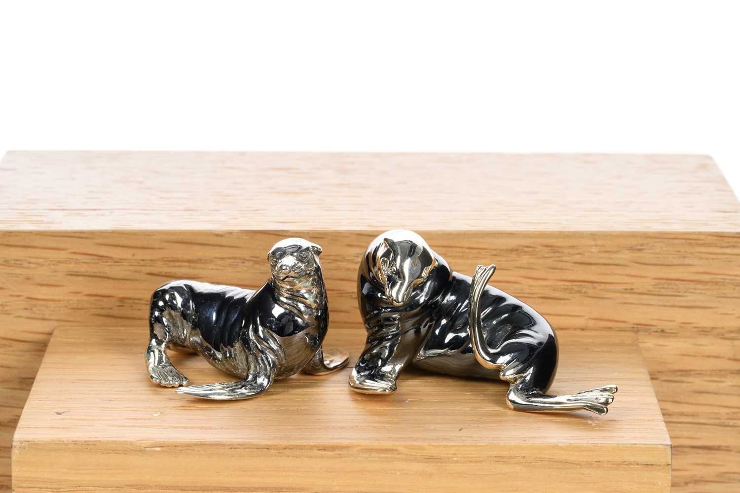 TWO SILVER AND NIELLO MINIATURE FIGURE, SATURNO