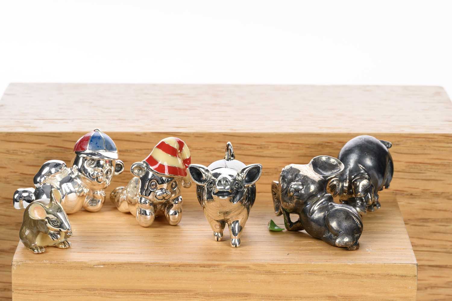 GROUP OF SILVER MINIATURE FIGURES, INCLUDING SATURNO