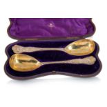 CASED PAIR OF VICTORIAN SILVER GILT SERVING SPOONS, MAKER INDISTINCT, LONDON 1875