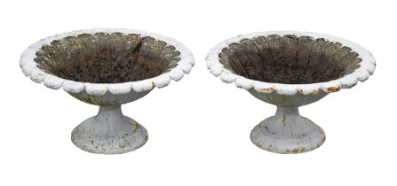 A pair of Victorian cast iron garden vases, the shallow scalloped bowl on flared foot, 31cm h;